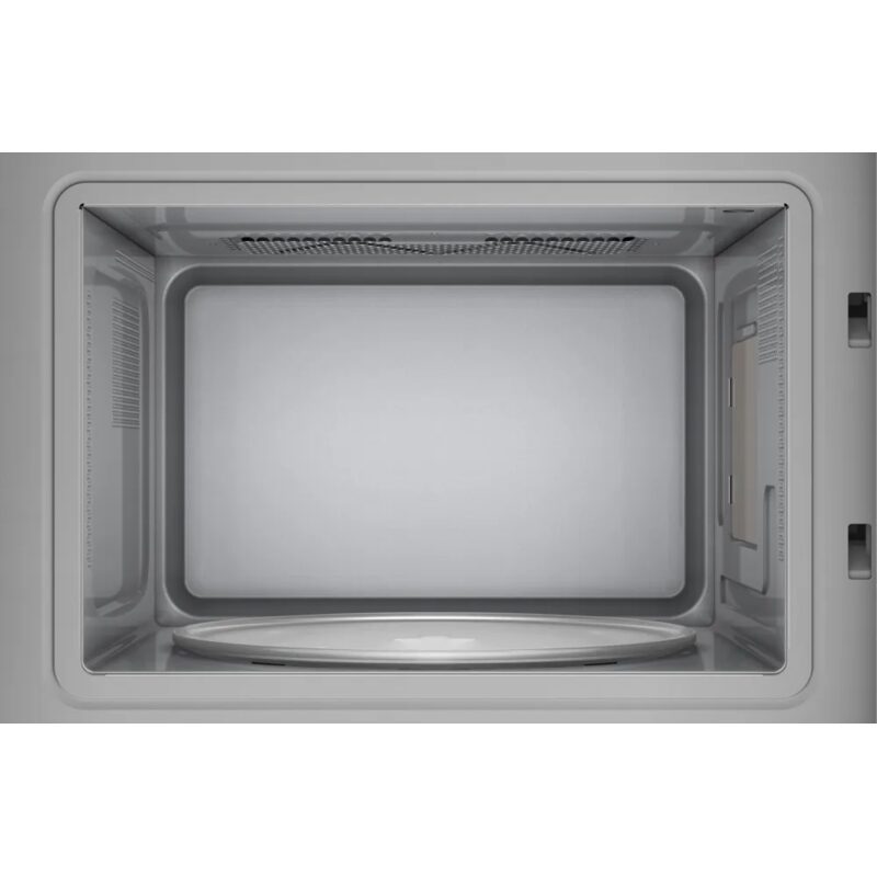 Intérieur d’un four micro-ondes vide gris