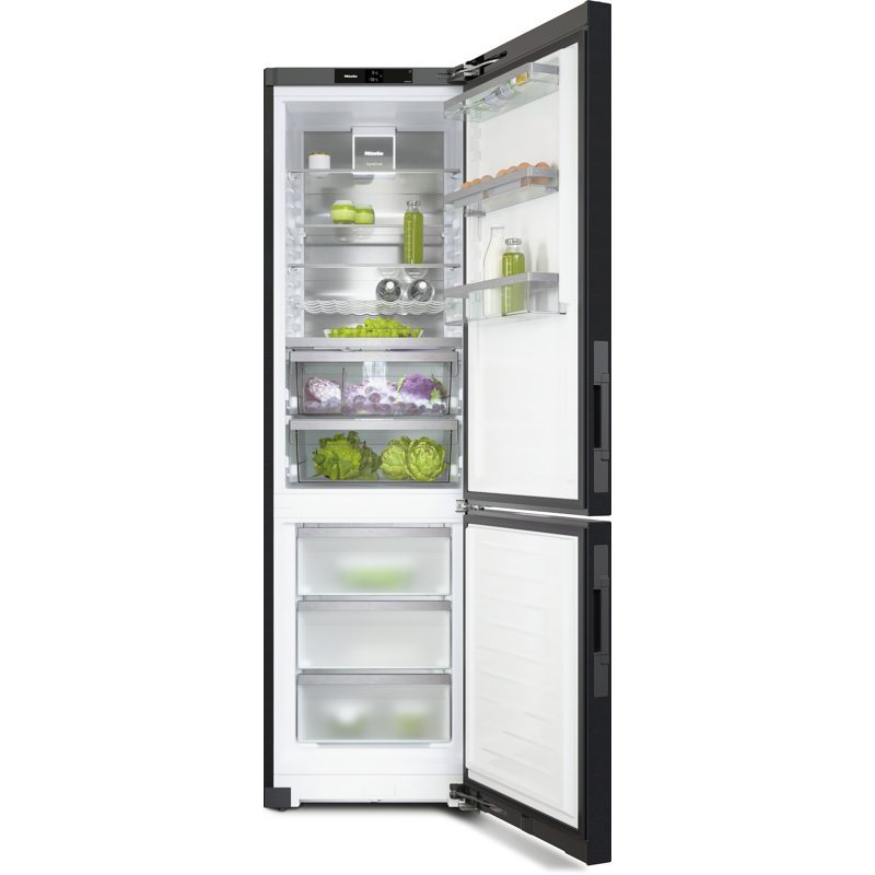 Réfrigérateur combiné ouvert avec aliments frais