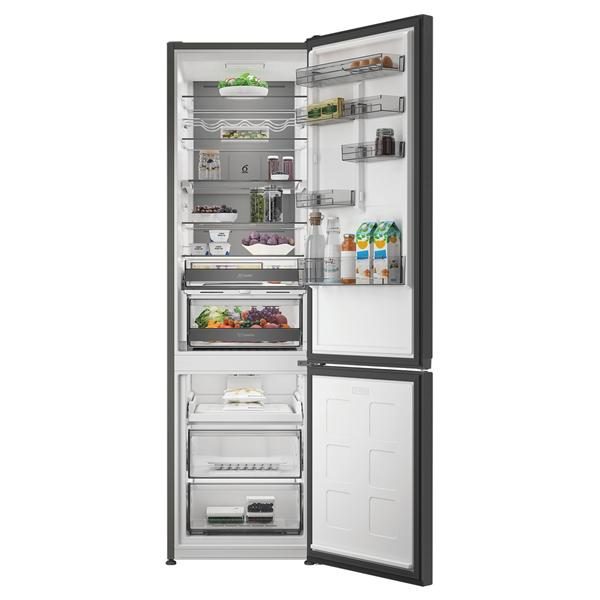 Réfrigérateur combiné ouvert avec aliments et boissons