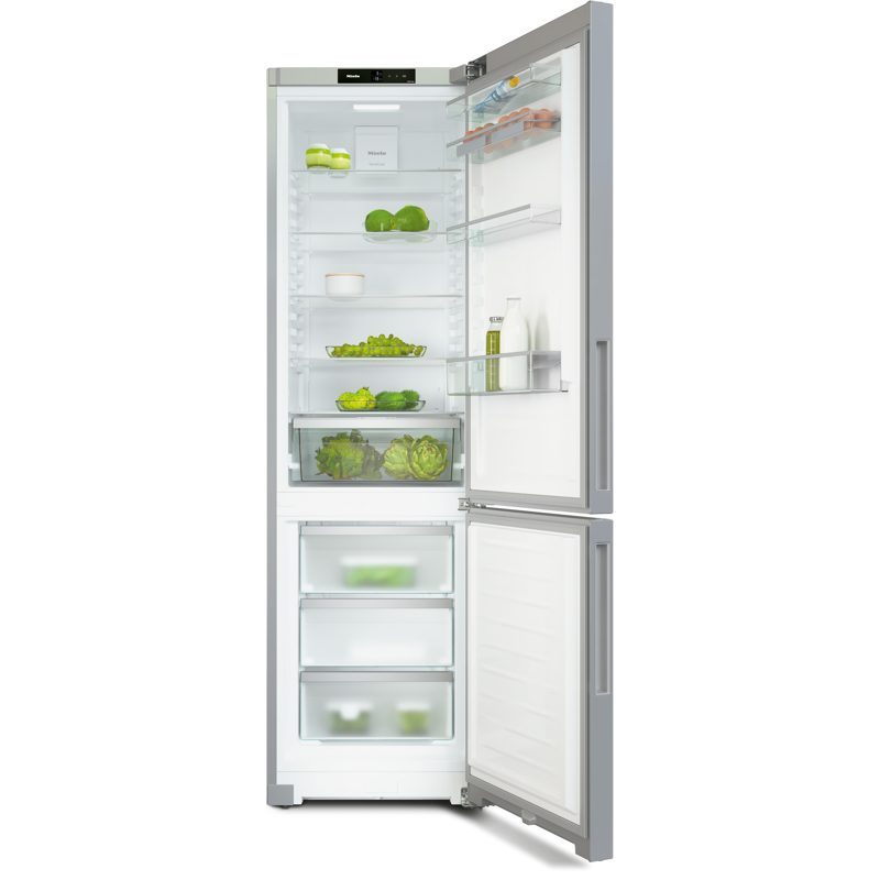 Réfrigérateur combiné ouvert avec aliments frais